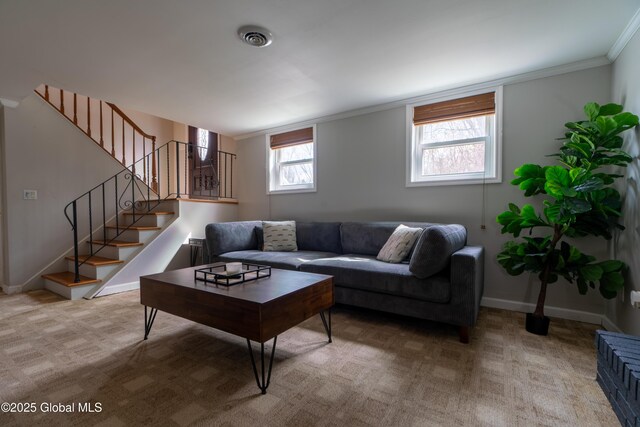 7 Bemis Heights Rd, Saratoga Springs, NY 12866 - living area with visible vents, baseboards, crown molding, stairs, and light carpet