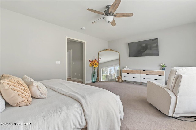 bedroom with ceiling fan and light carpet
