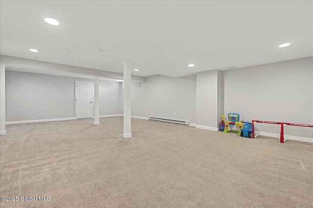 finished below grade area with recessed lighting, a baseboard heating unit, baseboards, and carpet floors