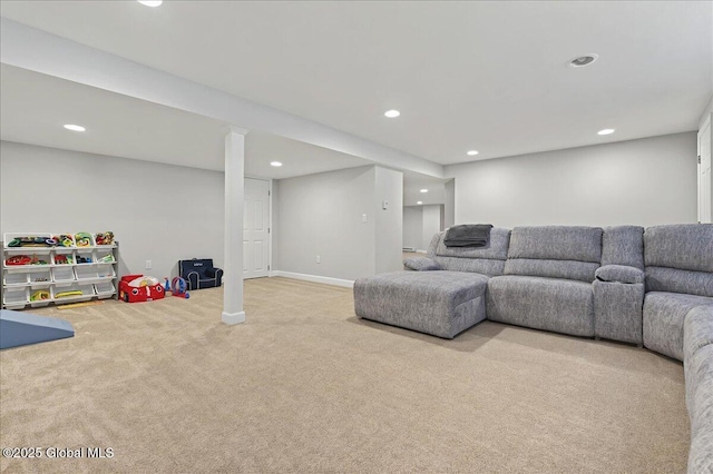 carpeted living area with recessed lighting