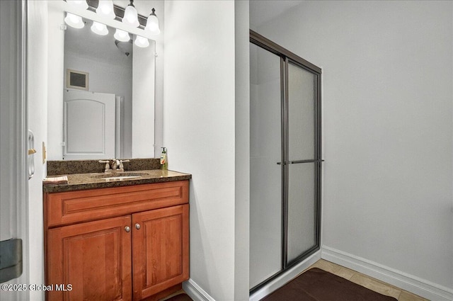 8 Wall St Apt 200, Clifton Park, NY 12065 - bathroom featuring a stall shower, vanity, and baseboards