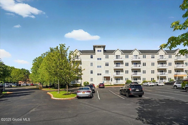 8 Wall St Apt 200, Clifton Park, NY 12065 - view of apartment building / complex with uncovered parking
