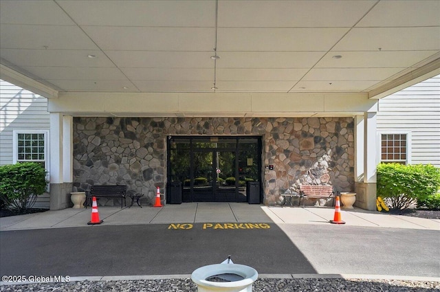 8 Wall St Apt 200, Clifton Park, NY 12065 - doorway to property featuring stone siding