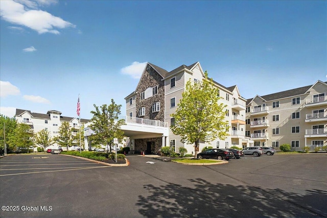 8 Wall St Apt 200, Clifton Park, NY 12065 - view of apartment building / complex with uncovered parking