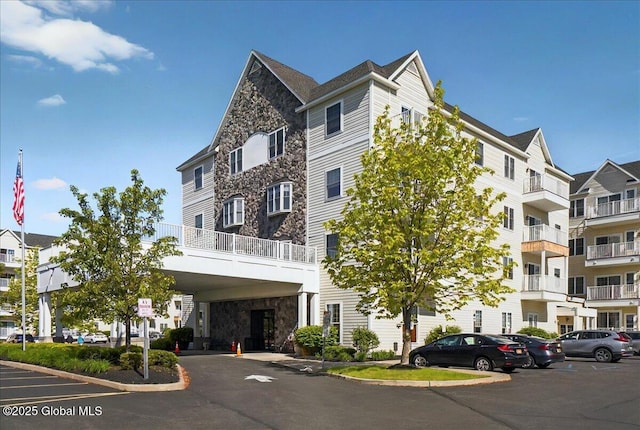 8 Wall St Apt 200, Clifton Park, NY 12065 - view of apartment building / complex featuring uncovered parking