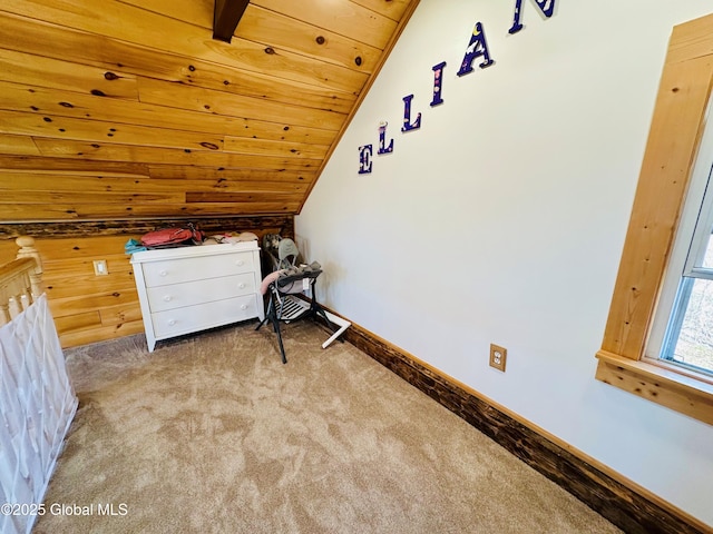 unfurnished bedroom with wooden ceiling, baseboards, vaulted ceiling, and carpet flooring