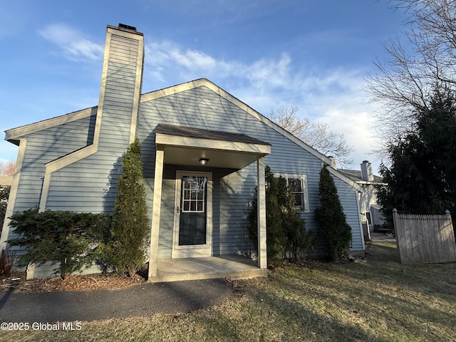 view of front of home featuring a chimney