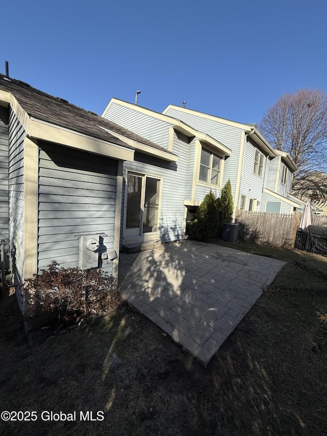 back of property with a patio and fence