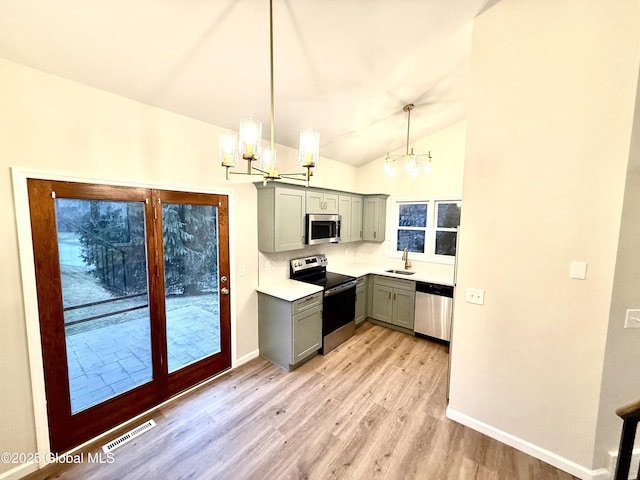 kitchen featuring visible vents, gray cabinets, an inviting chandelier, and appliances with stainless steel finishes