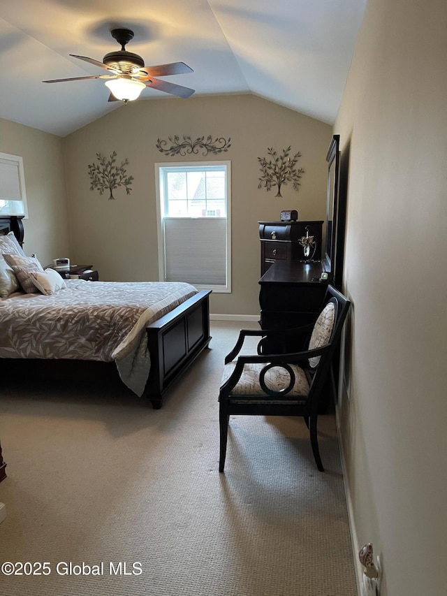 bedroom featuring baseboards, vaulted ceiling, a ceiling fan, and light colored carpet