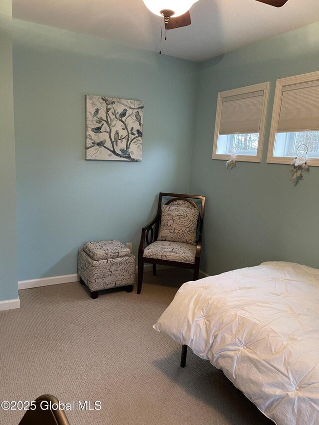 bedroom with baseboards, carpet, and a ceiling fan