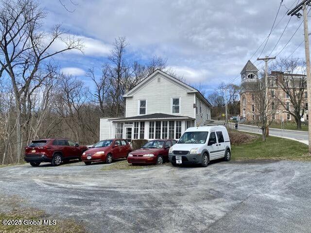 view of front of property with a sunroom