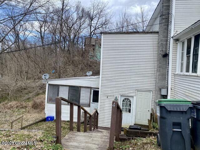 back of house with entry steps