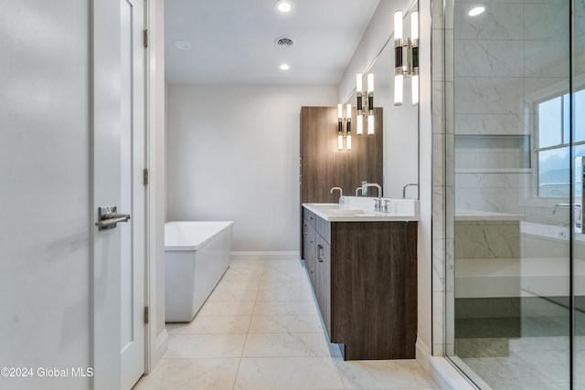 bathroom featuring vanity, a tub, a shower stall, marble finish floor, and visible vents