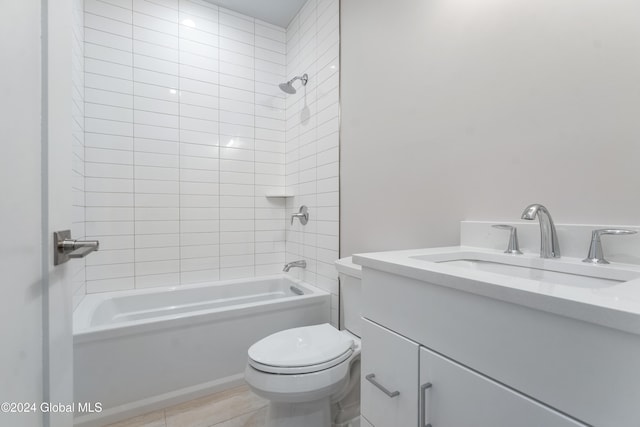 full bathroom featuring tub / shower combination, toilet, and vanity