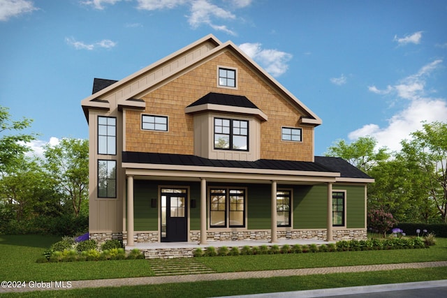 view of front of home with a front lawn, stone siding, a porch, metal roof, and a standing seam roof