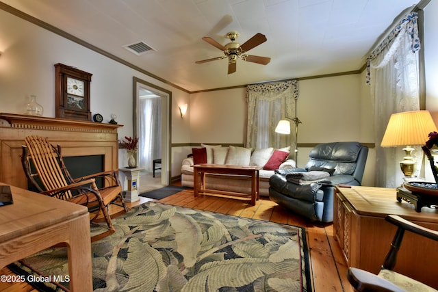 21 Andrews St, Saratoga Springs, NY 12866 - living area featuring ornamental molding, visible vents, a ceiling fan, and wood-type flooring