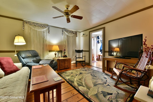 21 Andrews St, Saratoga Springs, NY 12866 - living area featuring ornamental molding, wood finished floors, and a ceiling fan
