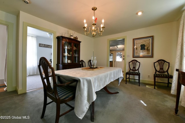 21 Andrews St, Saratoga Springs, NY 12866 - dining space with baseboards, dark carpet, and a chandelier