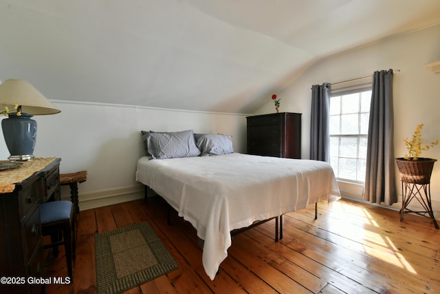21 Andrews St, Saratoga Springs, NY 12866 - bedroom featuring hardwood / wood-style floors, baseboards, and lofted ceiling