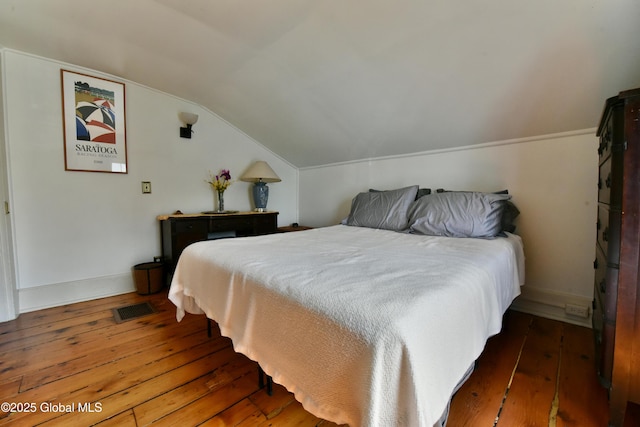 21 Andrews St, Saratoga Springs, NY 12866 - bedroom with wood-type flooring, baseboards, vaulted ceiling, and visible vents