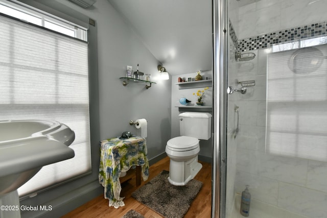 21 Andrews St, Saratoga Springs, NY 12866 - full bath with a shower stall, vaulted ceiling, wood finished floors, and toilet