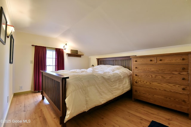 21 Andrews St, Saratoga Springs, NY 12866 - bedroom with baseboards, lofted ceiling, and light wood-style floors