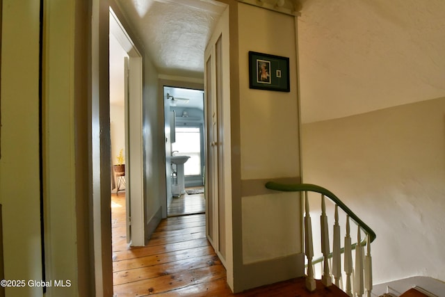 21 Andrews St, Saratoga Springs, NY 12866 - hallway with a textured ceiling and wood-type flooring