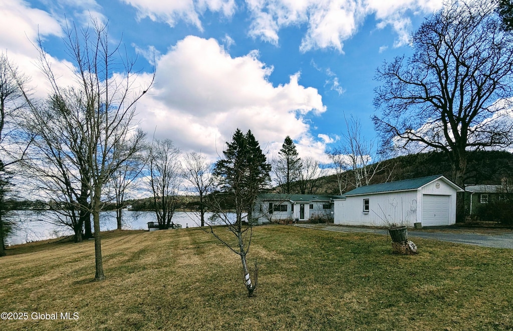 51 Sagamore Dr, Ticonderoga, NY 12883 - ranch-style house with driveway, a front yard, and a water view