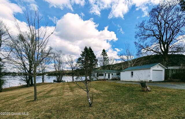 51 Sagamore Dr, Ticonderoga, NY 12883 - ranch-style house with driveway, a front yard, and a water view