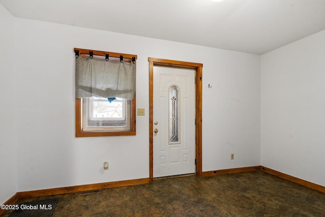 foyer featuring baseboards