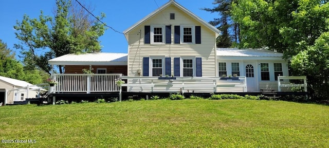 3183 State Highway 10, Ephratah, NY 12095 - rear view of property with metal roof, a wooden deck, and a yard