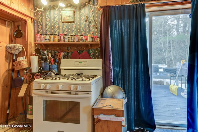 3183 State Highway 10, Ephratah, NY 12095 - kitchen featuring wallpapered walls and white gas stove