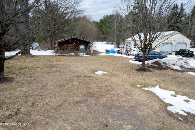 3183 State Highway 10, Ephratah, NY 12095 - yard covered in snow featuring an outbuilding and a garage