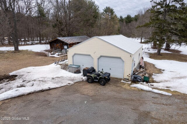 3183 State Highway 10, Ephratah, NY 12095 - snow covered garage with driveway