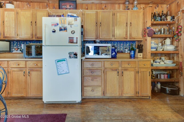 3183 State Highway 10, Ephratah, NY 12095 - kitchen with light wood-type flooring, light countertops, backsplash, and freestanding refrigerator