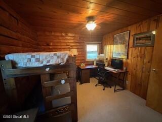 office featuring a ceiling fan, log walls, and wood ceiling