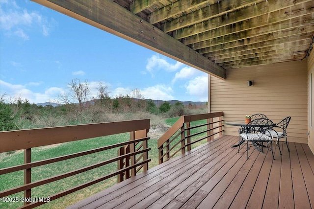 wooden deck featuring a mountain view