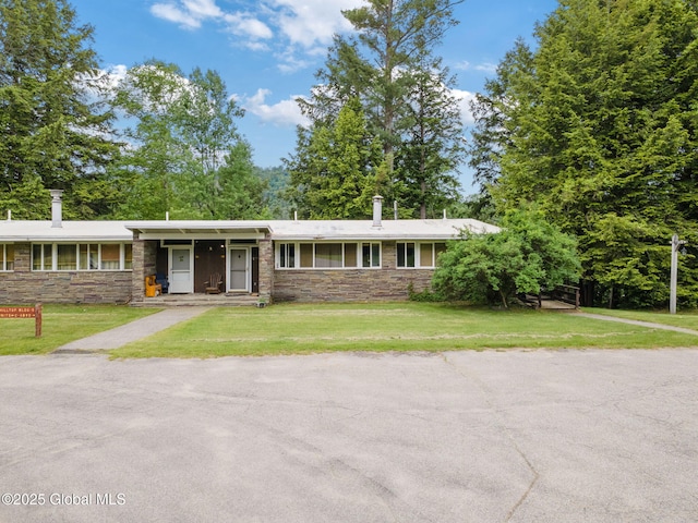5 Overlook Ln B/D, Unit B/D Warrensburg, NY 12817 - ranch-style home featuring stone siding and a front lawn