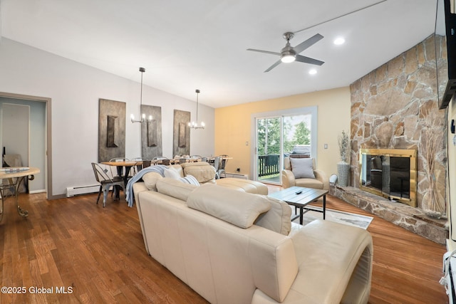 5 Overlook Ln B/D, Unit B/D Warrensburg, NY 12817 - living room with vaulted ceiling, a chandelier, ceiling fan, dark wood-style floors, and a fireplace