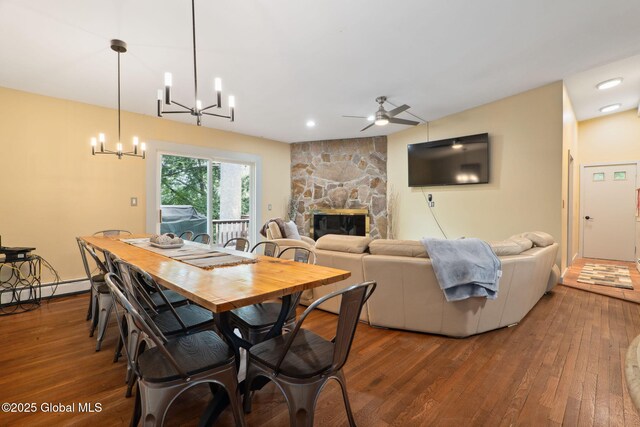 5 Overlook Ln B/D, Unit B/D Warrensburg, NY 12817 - dining space with hardwood / wood-style flooring, ceiling fan, a fireplace, and a baseboard radiator