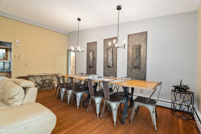 5 Overlook Ln B/D, Unit B/D Warrensburg, NY 12817 - dining space with a chandelier, wood finished floors, and a baseboard heating unit