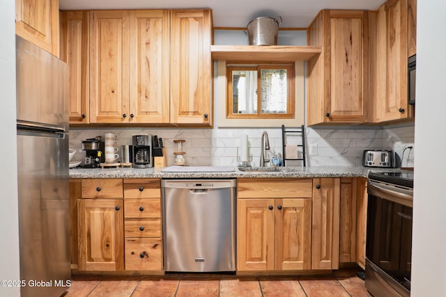 5 Overlook Ln B/D, Unit B/D Warrensburg, NY 12817 - kitchen with stainless steel appliances, decorative backsplash, light stone counters, and light tile patterned floors