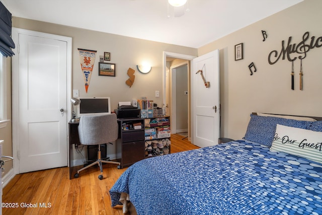 bedroom featuring baseboards and light wood-type flooring