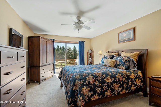 bedroom featuring light colored carpet, a ceiling fan, and access to outside
