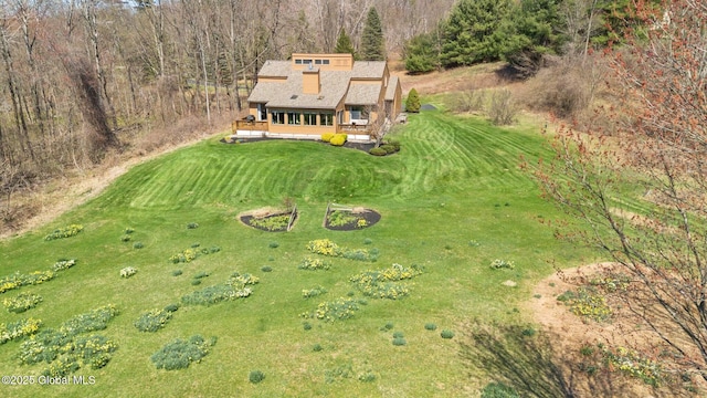 birds eye view of property with a view of trees