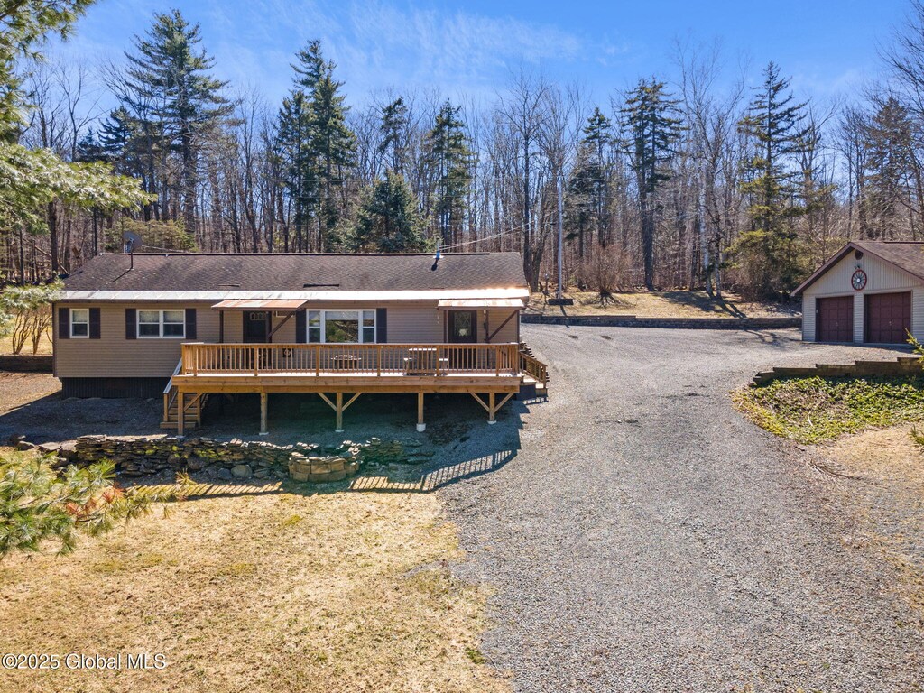 216 Eagle Mountain Rd, Summit, NY 12175 - view of front of home with driveway, a garage, an outdoor structure, and a deck