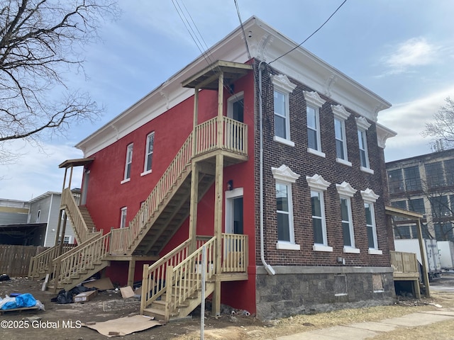 italianate house featuring brick siding