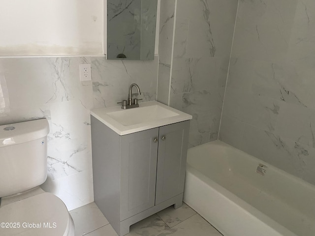 full bathroom featuring marble finish floor, vanity, and toilet