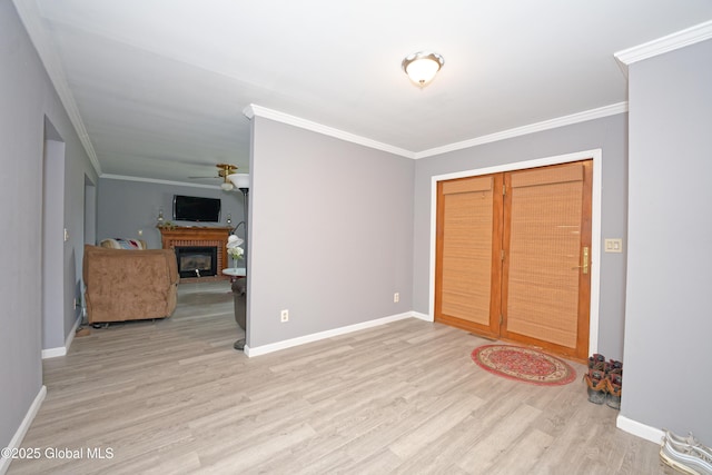 18 Molly White Dr, Coxsackie, NY 12051 - unfurnished bedroom with wood finished floors, baseboards, ornamental molding, and a brick fireplace